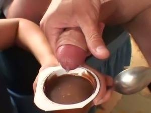 Eating cum with chocolate pudding