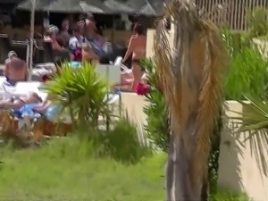 Lanzaroti topless sunbather in resort