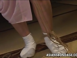 Asian babe in rope bondage scene