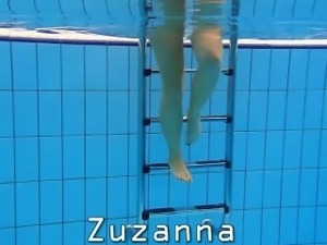 Cute Zuzanna is swimming nude in the pool