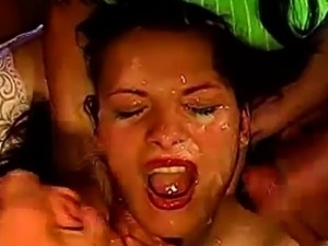 Bukkake sluts share cum in bizarre group facials