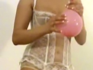 Lady in stockings blowing up balloons