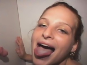 Redheaded Amateur Working Over Dick Through Glory Hole