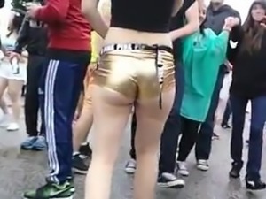 golden shorts exposing ass cheek walking