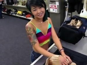 Very cute Asian teen massages a big dick until it gets hard