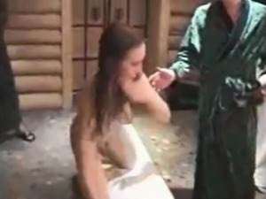 Flogging slave Laura in a sauna