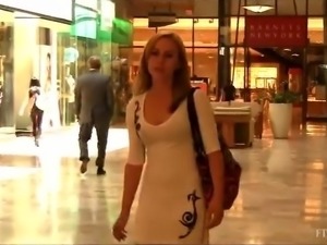 Blonde striptease in public mall