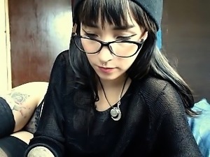 Cute brunette using toys on webcam