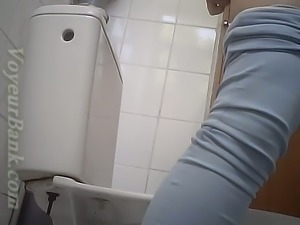 Lovely stranger chick in blue tight jeans filmed in the toilet room