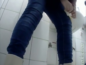 Pale skin stranger girl with shaved pussy recorded on voyeur cam in the toilet
