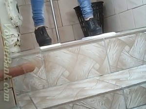 Slender girl in very tight blue jeans filmed in the toilet room