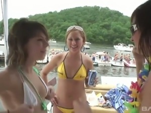 Lots of lusty and dirty amateur bikini gals kiss and have fun on the yacht