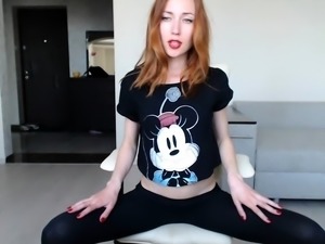 Sexy redhead camgirl exposes her slim body and tight peach