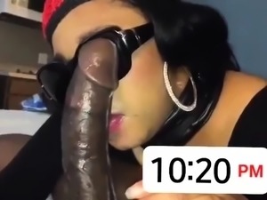 Seductive ebony babe milks a huge black cock with her lips