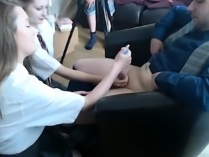 Two naughty schoolgirls put their hands to work on a dick