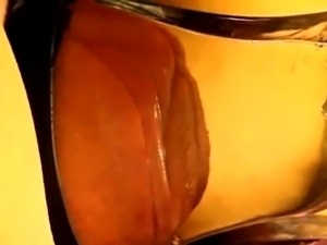 pumped pussy lips in a tight, flat glass tube