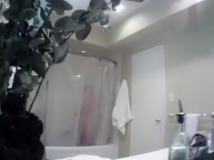 Hidden cam captures big boobed stepsis naked in the bathroom