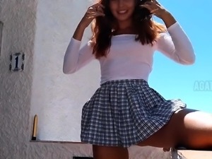 Beautiful schoolgirl fucking herself with a dildo outdoors
